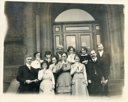 Adelphi College faculty eating popsicles, 1921